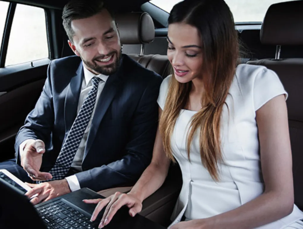 Business Executive Working Inside Luxury Car