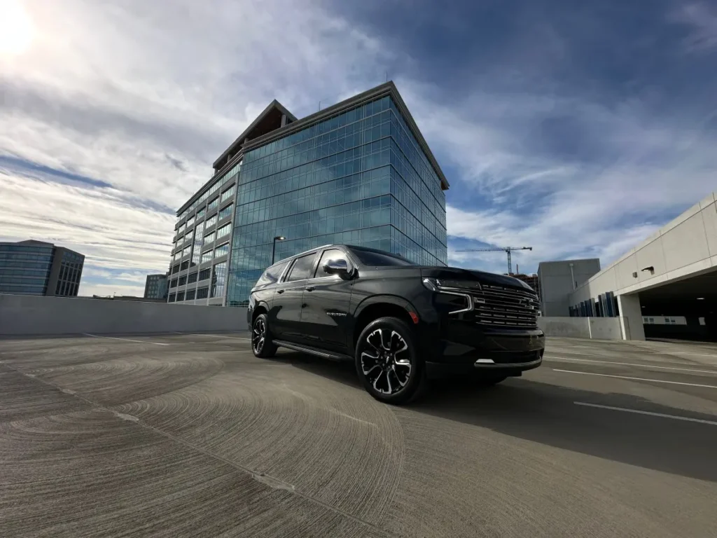 luxury black car corporate office building